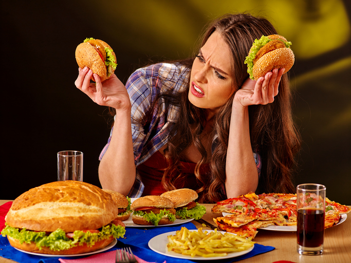 Girl eating big sandwich