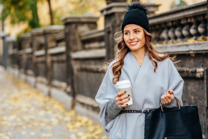 Young woman drinking coffee outdoors
