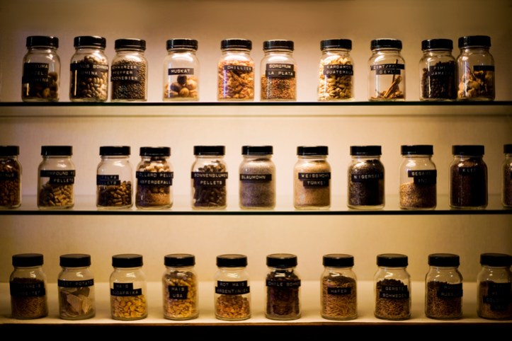 Shelves with labeled jars of exotic spices